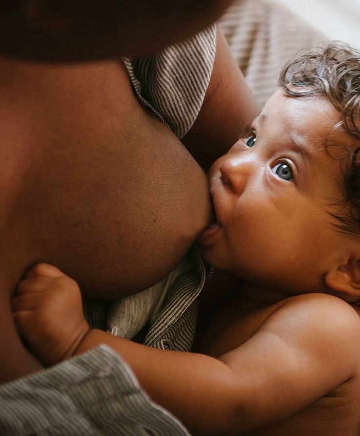 woman breastfeeding her baby